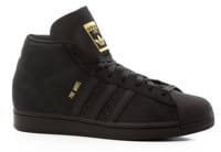 black and gold high top adidas